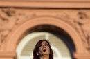 FILE - In this Dec. 10, 2011 file photo, Argentina's President Cristina Fernandez sings her country's national anthem after her swearing-in ceremony outside the government house in Buenos Aires, Argentina. Both supporters and opponents of Fernandez are invoking the threat of a constitutional change to allow a third consecutive presidential term. Fernandez has no interest in appearing to be a lame duck, and analysts say her silence on the question has helped her thwart would-be challenges to her near-absolute power. (AP Photo/Natacha Pisarenko, File)