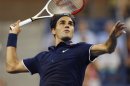 Federer of Switzerland comes to the net against Phau of Germany during their match at the US Open men's singles tennis tournament in New York