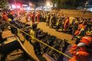 Rescue workers line up bags with dead bodies of victims of an explosion at a night market in Davao City, on the southern Philippine island of Mindanao, early on September 3, 2016
