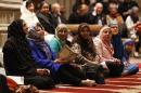 Women talk as the Washington National Cathedral and five Muslim groups hold the first celebration of Muslim Friday Prayers, Jumaa, in the Cathedral's North Transept in Washington