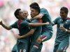 Mexico's Peralta celebrates with his team mates after scoring a goal against Brazil during their men's football gold medal match at Wembley Stadium during the London 2012 Olympic Games