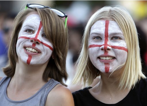 England soccer fans with painted face smile during Euro 2012 soccer match between France and England at the Euro 2012 fan zone in Donetsk