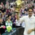 Roger Federer of Switzerland holds the winners trophy after defeating Andy Murray of Britain in their men's final tennis match at the Wimbledon Tennis Championships in London