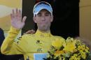 Italy's Vincenzo Nibali, wearing the overall leader's yellow jersey, celebrates on the podium of the sixteenth stage of the Tour de France cycling race over 237.5 kilometers (147.6 miles) with start in Carcassonne and finish in Bagneres-de-Luchon, France, Tuesday, July 22, 2014. (AP Photo/Christophe Ena)