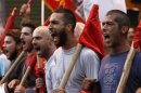 Protesters from the communist-affiliated trade union PAME shout slogans during a rally in the city of Thessaloniki