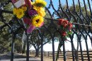 Southfork Ranch can be seen through a gate where fans left flowers Saturday, Nov. 24, 2012, in Parker, Texas. The flowers were in memory of Larry Hagman, who played J.R. Ewing on the TV series Dallas, set at Southfork. Hagman died Friday, Nov. 23, 2012 in Dallas. He was 81. (AP Photo/Angela K. Brown)