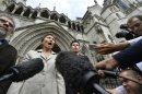 Maria Litvinenko, the widow of former Russian spy Alexander Litvinenko, speaks to members of the media as she leaves the High Court in London
