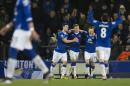 Everton's Ross Barkley, second left, celebrates with teammates after scoring his first penalty during the English Premier League soccer match between Everton and Newcastle at Goodison Park Stadium, Liverpool, England, Wednesday Feb. 3, 2016. (AP Photo/Jon Super)