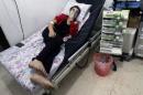 A civilian breathes through an oxygen mask at al-Quds hospital, after a hospital and a civil defence group said a gas, what they believed to be chlorine, was dropped alongside barrel bombs on a neighbourhood of the Syrian city of Aleppo
