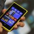 A Nokia executive shows the new Lumia 920 phone with Microsoft's Windows 8 operating system at a launch event in New York