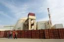 Russian worker walks past Bushehr nuclear power plant, 1,200 km south of Tehran