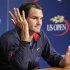 Switzerland's Federer answers questions at a news conference ahead of the 2012 U.S. Open tennis tournament in New York