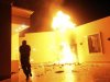 The U.S. Consulate in Benghazi is seen in flames during a protest