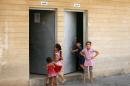 Iraqi children who fled their homes with their families due to violence in northern Iraq are seen in a school where they are taking shelter, in Arbil, on August 29, 2014