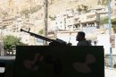 A Syrian soldier mans a machine gun in the Syrian Christian town of Maalula on September 7, 2013