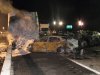 A tractor-trailer still smolders hours after a chain-reaction crash on the Long Island Expressway on Wednesday, Dec. 19, 2012 in Shirley, N.Y. At least one person was killed and 32 others were injured in the pileup, which involved about two dozen vehicles. (AP Photo/Frank Eltman)