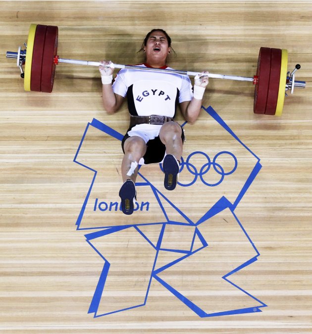 Egypt's Khalil K Abir Abdelrahman falls after failed attempt on the women's 75Kg group A weightlifting competition at the ExCel venue at the London 2012 Olympic Games