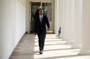 U.S. President Obama walks from his residence to the Oval Office at the White House in Washington