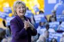 Democratic presidential candidate Hillary Rodham Clinton acknowledges supporters after filing papers to be on the nation's earliest presidential primary ballot, Monday, Nov. 9, 2015, in Concord, N.H. (AP Photo/Jim Cole)
