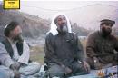 In this undated Photo provided by the United States Attorney's Office for the Southern District of New York, defendant Suliman Abu Ghayth, right, is seated with al-Qaida founder Osama Bin Laden, center, and Bin Laden's deputy, Ayman al Zawahiri, in Afghanistan. Suliman Abu Ghayth, is being tried in New York, charged with plotting to kill Americans by being a motivational speaker at al-Qaida training camps before the Sept. 11 attacks and as a spokesman for the terror group afterward when it sought to recruit more militants to its cause. (AP Photo/US Attorney's Office for the Southern District of New York)