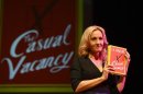 Author J.K Rowling poses for photographers with a copy of her adult fiction book "The Casual Vacancy", at the Queen Elizabeth Hall in London