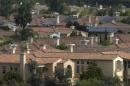 File photo of solar panels are pictured on the rooftops of residential homes in San Diego, California