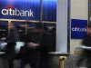People walk by a Citibank branch in New York