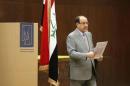 Iraq's Prime Minister Nuri al-Maliki prepares to vote during parliamentary election in Baghdad