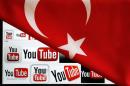 YouTube logos displayed on a laptop screen partially covered with Turkey's national flag in this photo illustration taken in Ankara