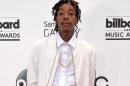 FILE - This May 18, 2014 file photo shows rapper Wiz Khalifa at the Billboard Music Awards in Las Vegas. Wiz Khalifa has been arrested in Texas for marijuana possession, authorities say. Born Cameron Thomaz, of Cannonsburg, Pennsylvania, he was stopped at a TSA inspection checkpoint at the El Paso airport and because he traveled without an identification document, a secondary search was ordered. It resulted in the finding of a canister with marijuana. (Photo by John Shearer/Invision/AP, File)