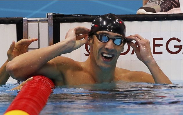 Michael Phelps of the U.S. celebrates winning gold in the men's 100m butterfly final during the London 2012 Olympic Games at the Aquatics Centre