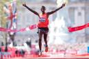 Wilson Kipsang of Kenya crosses the line to win the men's race in the 2014 London Marathon on The Mall in central London on April 13, 2014