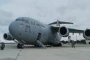 STOWAWAY FOUND DEAD ON MILITARY PLANE