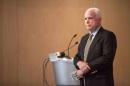 Senator John McCain attends a community forum over recent allegations of gross mismanagement and neglect of veterans health care in Phoenix