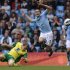 Norwich City's Whittaker challenges Manchester City's Rodwell during their English Premier League soccer match in Manchester