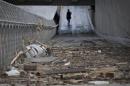 Debris left from flood waters litters a downtown sidewalk in Calgary