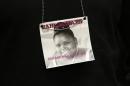 A photograph of 13-year-old Jahi McMath is seen on a necklace in Oakland