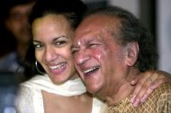 This file photo shows legendary Indian sitar player Ravi Shankar (R) sharing a joke with his daughter Anoushka (L) during a press conference in Calcutta, on December 18, 2002. Shankar performed his last concert on November 4, 2012 in Long Beach, California, with his daughter and fellow sitar player Anoushka
