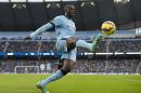 Manchester City's Ivorian midfielder Yaya Toure controls the ball during a English Premier League football match against Swansea City in Manchester, England, on November 22, 2014
