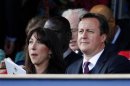 Britain's Prime Minister David Cameron and his wife Samantha watch during the Diamond Jubilee concert in front of Buckingham Palace in London