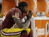 Washington Redskins quarterback Robert Griffin III sits on the bench after a knee injury during an NFL wild card playoff football game against the Seattle Seahawks in Landover, Md., Sunday, Jan. 6, 2013. The Seahawks defeated the Redskins 24-14. (AP Photo/Evan Vucci)