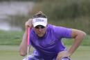 Ian Poulter looks at his line on the second green during the third round of the Honda Classic golf tournament, Sunday, March 1, 2015, in Palm Beach Gardens, Fla. (AP Photo/Luis M. Alvarez)