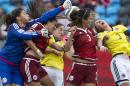 Mexico goalkeeper Cecilia Santiago, left, Nayell Ranger, second from left, and Christina Murillo, second from right, battle for the ball with Colombia's Diana Ospina and Natalia Gaitan, right, during the first half of a FIFA Women's World Cup soccer match in Moncton, New Brunswick, Canada, Tuesday, June 9, 2015. (Andrew Vaughan/The Canadian Press via AP) MANDATORY CREDIT