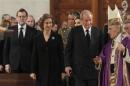 Spanish King Juan Carlos (2nd right) and Queen Sofia (centre) and Spanish Prime Minister Mariano Rajoy (left) attend the commemorative mass held for the victims of the Madrid train bombings at the Almudena Cathedral in Madrid, on March 11, 2014