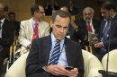 Carney takes his seat before the IMFC committee meeting during the semi-annual meetings of the IMF and the World Bank in Washington