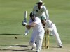 South African batsman AB de Villiers plays a shot as Pakistan's wicketkeeper Sarfraz Ahmed looks on during the first day of the third cricket test match in Pretoria