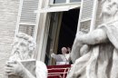 Pope Benedict XVI waves to the crowd from his studio's window overlooking St. Peter's square during the Angelus prayer at the Vatican, Sunday, June 10, 2012. (AP Photo/Riccardo De Luca)