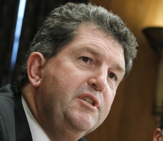 FILE - This Sept. 6, 2011 file photo shows Postmaster General Patrick Donahoe testifying on Capitol Hill in Washington. The struggling U.S. Postal Service on Thursday reported an annual loss of a record $15.9 billion, capping a tumultuous year in which it was forced to default for the first time on billions in payments to avert bankruptcy. (AP Photo/J. Scott Applewhite, File)