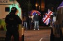 Loyalist protesters block Cregagh Road in East Belfast after a decision was made to remove the British flag from Belfast's City Hall