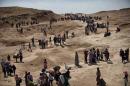 Displaced Iraqis from the northern town of Sinjar head towards the autonomous Kurdistan region on August 4, 2014, as they seek refuge from Islamic State (IS) Sunni militants